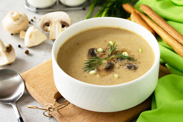 Vegan and diet healthy food. Mushroom soup puree with cream, champignons and vegetables.