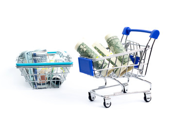 shopping cart with a shopping basket with one hundred dollar bills on a white background. isolate