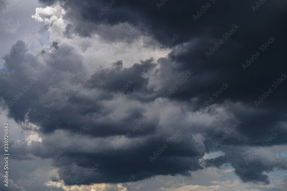 Wall mural terrible thunderclouds from the side of a plane. gloomy epic clouds. background image in a dark gray
