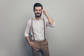Portrait of charming elegant broker attorney man look good touch his spectacles put hands pocket wear modern clothes isolated over gray color background