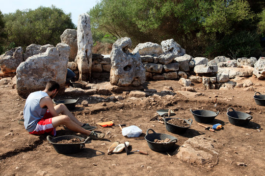 Torre d'en Galm&eacute;s, Menorca / Spain - June 23, 2016: Archaeologist in Prehistoric area at Torre d'en Galm&eacute;s, Menorca, Balearic Islands, Spain