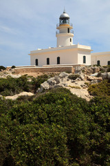 Fototapeta na wymiar Cape Cavalleria, Menorca / Spain - June 23, 2016: The lighthouse at Cape Cavalleria, Menorca, Balearic Islands, Spain