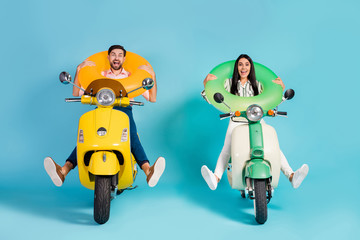 Full length photo of funky two people lady guy drive retro moped good mood spread legs crazy hold...
