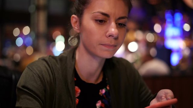 Woman making gross face while dining in a restaurant leaving the food after
