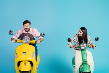 Photo of rushing funny two people lady guy drive retro moped big speed travelers avoiding traffic jam easy way good mood formalwear clothes isolated blue color background