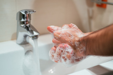 Man washing his hands. Close up