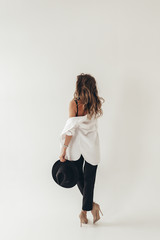 The concept of a trendy modern fashion trend shooting in a photo Studio , a beautiful sexy...
