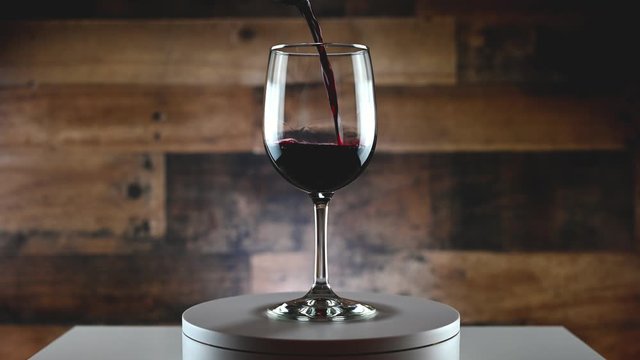 pouring red wine into glass 360 rotation