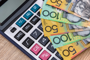 Australian money aud with calculator on desk.