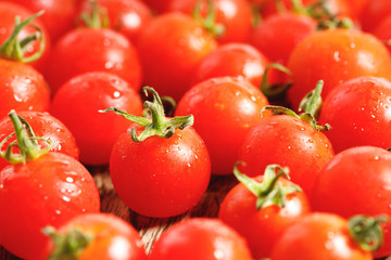 red cherry tomato on wooden background