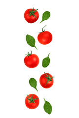 Falling red cherry tomatoes and spinach leaves isolated on a white background, clipping path. Flying food.