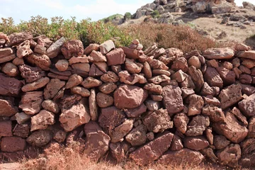 Photo sur Plexiglas Cala Pregonda, île de Minorque, Espagne Cala Pregonda, Menorca / Spain - June 23, 2016: A dry stone wall, Menorca, Balearic Islands, Spain