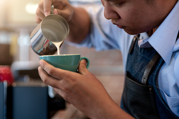 making of coffee latte in coffee shop cafe