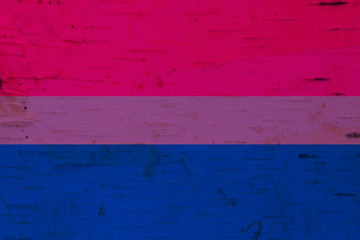 A rustic old bisexual flag on weathered wood - obrazy, fototapety, plakaty