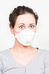 caucasian brunette woman in protective medical mask on face protection for spreading of disease...