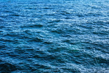 The surface of the blue sea with ripples