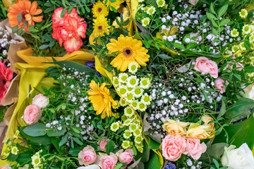 Obraz na płótnie Canvas Festive bouquets of different flowers - roses, gypsophila, daisies, gerbera.