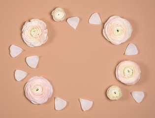 Greeting card with flowers. Caramel color background. Tender photo.