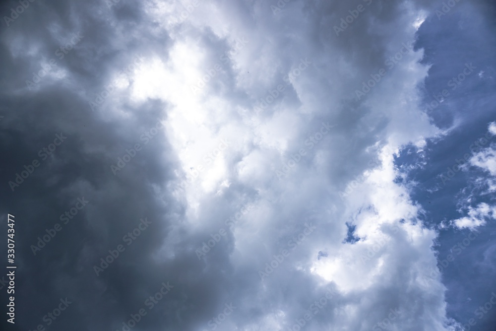 Wall mural terrible thunderclouds from the side of a plane. gloomy epic clouds. background image in a dark gray