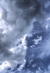Terrible thunderclouds from the side of a plane. Gloomy epic clouds. Background image in a dark gray style.