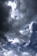 Terrible thunderclouds from the side of a plane. Gloomy epic clouds. Background image in a dark...