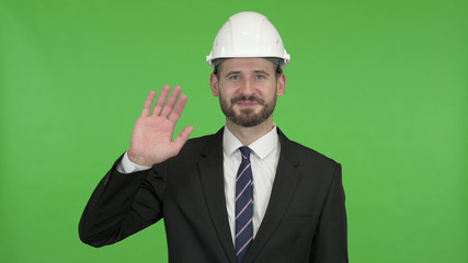 The Ambitious Engineer Waving Hand Sign and Talking against Chroma Key