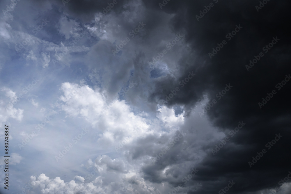 Wall mural terrible thunderclouds from the side of a plane. gloomy epic clouds. background image in a dark gray