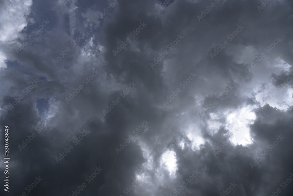 Sticker terrible thunderclouds from the side of a plane. gloomy epic clouds. background image in a dark gray