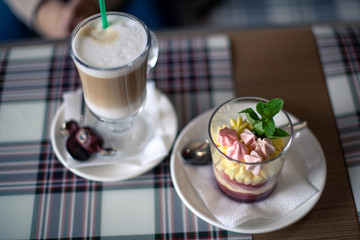 cup of latte and dessert with mint