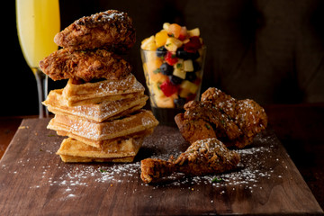 Chicken & waffles. Classic American Diner Style Breakfast or Brunch menu item favorite. Crispy homemade fried chicken on top of home buttermilk waffles topped with butter and maple syrup. 