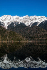 mountains in winter and mountain's reflection in the lake