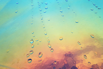 holographic plastic with water drops. abstract background