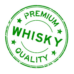Grunge green premium quality whisky word round rubber seal stamp on white background