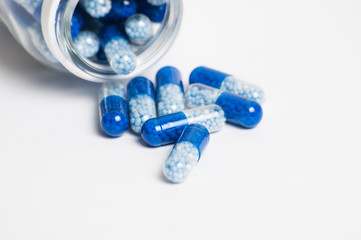 Pills on white background close-up macro. The concept of medicine and protection against coronavirus