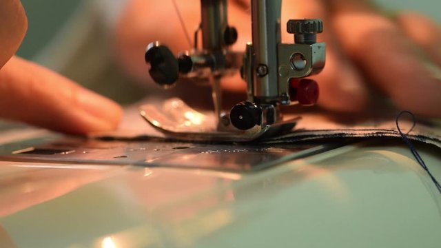 Close up dressmaker sewing fabric factory fashion clothing craft production full HD 1080p