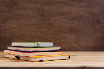 notepad or paper notebook at wooden table