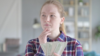 The Serious Young Woman Counting money