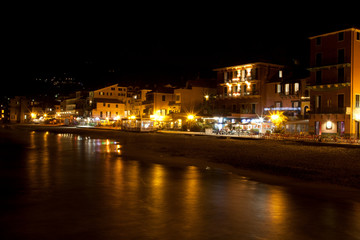 Fototapeta na wymiar Alassio (SV), Italy - February 15, 2017: Alassio town at night, Riviera dei Fiori, Savona, Liguria, Italy.