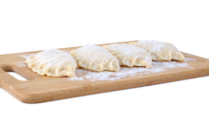 Fototapeta na wymiar Raw dumpling with cheese. Preparation dumplings on a wooden board