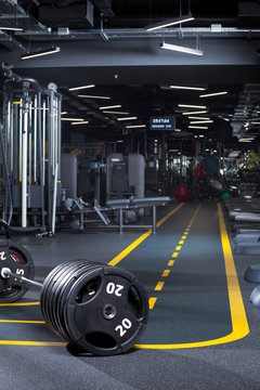 empty gym interior background with fitness and weight-lifting machines