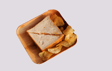 Closeup of Indian street food bread pieces sandwich ,in a disposable plate                               