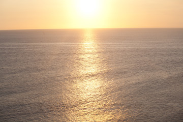 beautiful scenic ocean sunset empty background with beach, rocks and waves