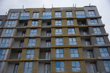 Mineral wool insulation of the facade building on construction site. Insulation for thermal...