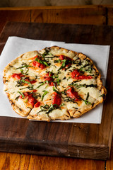 Pizza. Classic traditional Italian entrée favorite. New York Style Pizza with marinara sauce and topped with mozzarella cheese, meats and fresh vegetables. Baked in wood burning oven
