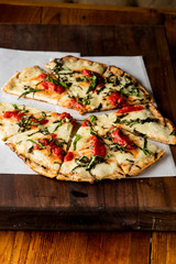 Pizza. Classic traditional Italian entrée favorite. New York Style Pizza with marinara sauce and topped with mozzarella cheese, meats and fresh vegetables. Baked in wood burning oven