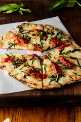 Pizza. Classic traditional Italian entrée favorite. New York Style Pizza with marinara sauce and topped with mozzarella cheese, meats and fresh vegetables. Baked in wood burning oven