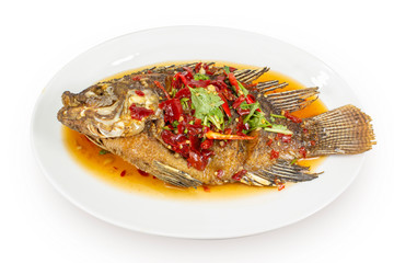 Whole Fried Fish Topped With Sweet Chili three flavors in a white bowl, Thai food.