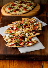 Pizza. Classic traditional Italian entrée favorite. New York Style Pizza with marinara sauce and topped with mozzarella cheese, meats and fresh vegetables. Baked in wood burning oven