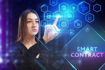 Business, Technology, Internet and network concept. Young businessman working on a virtual screen of the future and sees the inscription: Smart contract