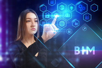 Business, Technology, Internet and network concept. Young businessman working on a virtual screen of the future and sees the inscription: BIM